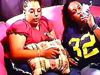 Chubby black chicks smoke on the couch